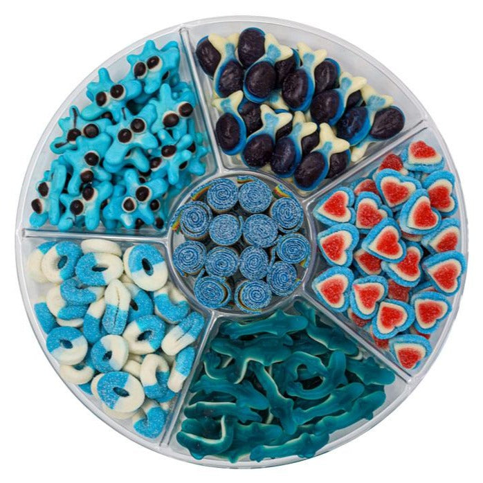 candy platter with Blue and White Gummy Sharks, Blue Triple Layer Hearts, Sour Blue Raspberry Rings, Sour Quattro Belts, Blue Gummy Sand Sharks and Blue Gummy Blobs.