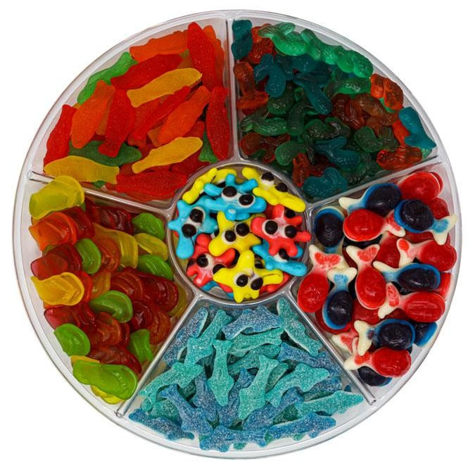 candy platter with gummy ocean blobs, assorted Swedish fish, gummy mermaid tails, gummy filled whales, sour sharks & chewy flavored flip flops and more.